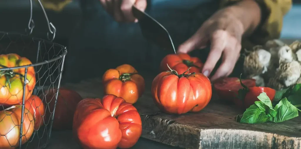 Chef cutting red capsicum