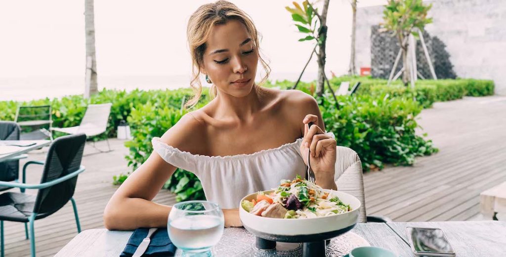 Should Your Restaurant Follow Diet Trends? - female diner eating a salad